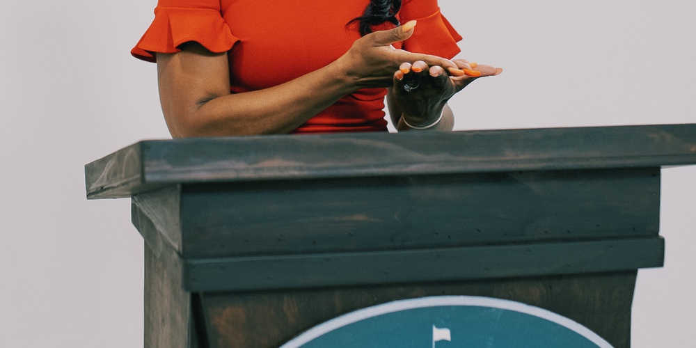 Display QR codes on podium signs